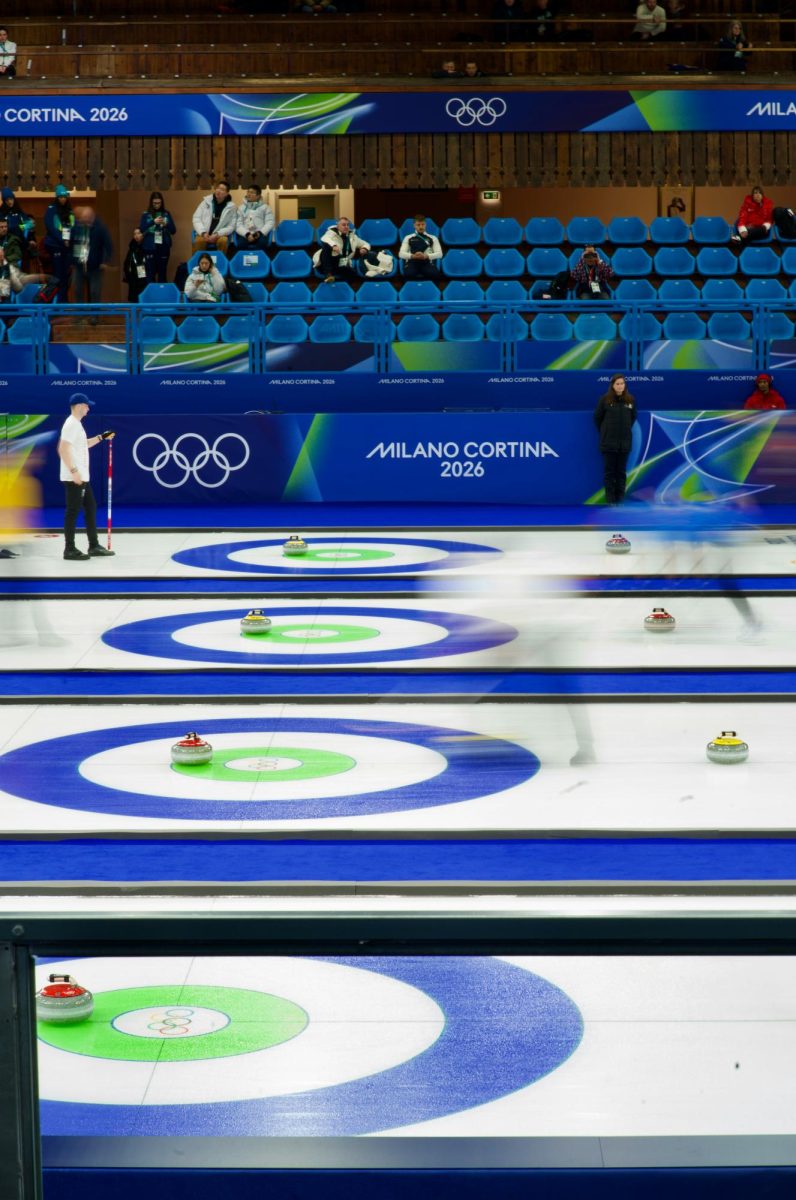 Curling athletes step onto the ice this winter during the Milan Cortina 2026 Olympics. Photo by Sreyus Guruvu via Unsplash.